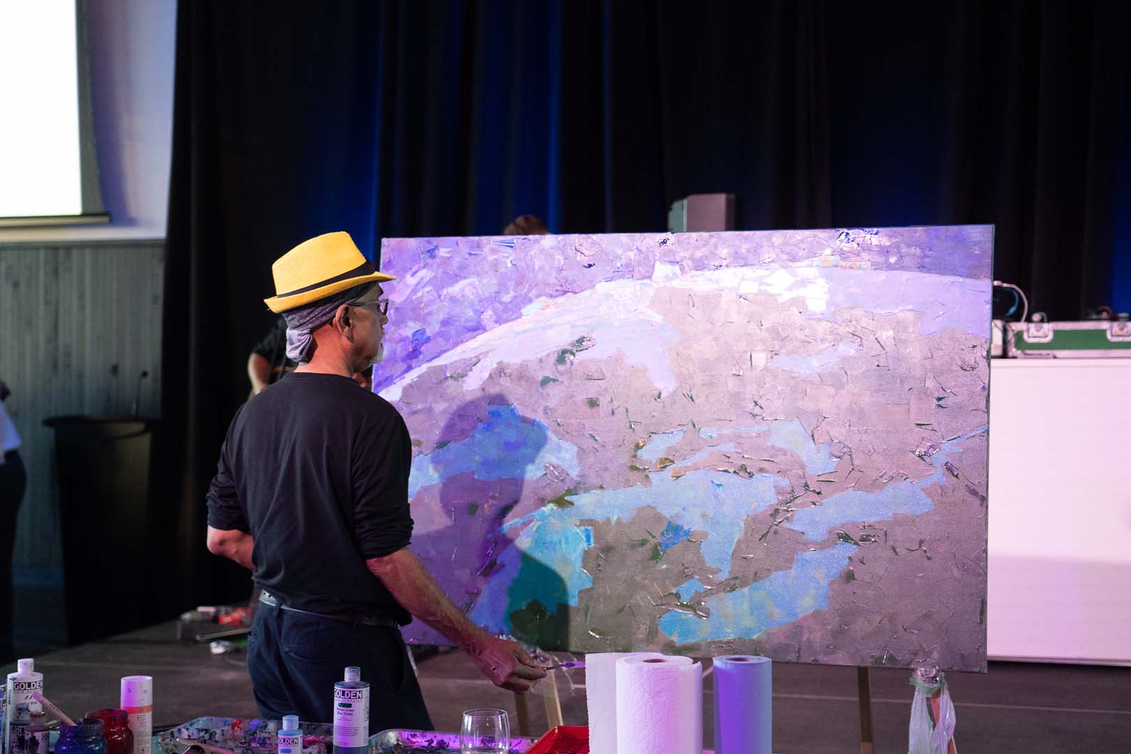 Man painting globe